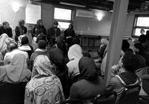 Students and community members gather for an interfaith discussion at Cedar Commons. Augsburg University Archives.