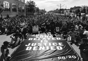 "One Day in May" Banner during the George Floyd Protest March to the Minnesota State Capitol, 2020. Augsburg University Archives.